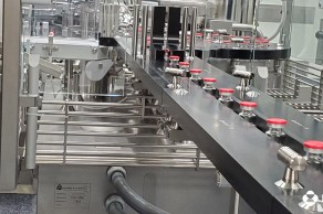 Image for Filled vials exiting the vial capping machine